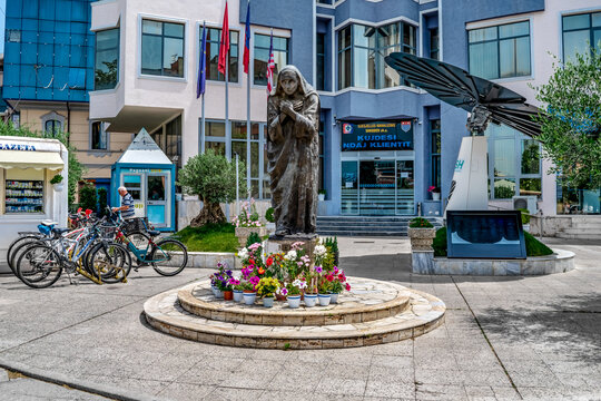 Shkoder, Albania - June 21, 2021: Statue of Mother Teresa (Nene Tereza) on Rruga Kole Idromeno Street in Shkodra. Sculpture of a famous Catholic nun on a city street