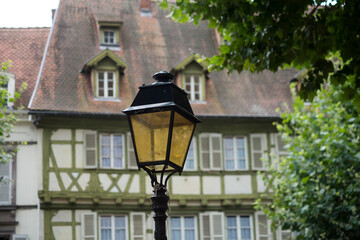 Fototapeta na wymiar Closeup of retro street light in a typical french city of Colmar - France
