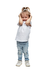 A little girl stands and laughs with her head clasped in her hands. Child 4 years old in a white T-shirt and jeans. Isolated on white background. Vertical.