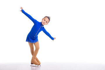 A Little young figure skater posing in blue training dress on ice on white background