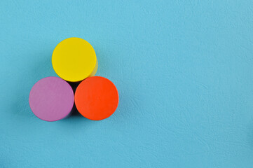 Colorful wooden cube blocks isolated on a blue background