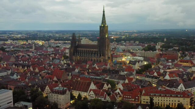 Germany, Baden-W&uuml;rttemberg, Ulm. Aerial view of the Ulm Cathedral (Ulmer M&uuml;nster) in at dusk