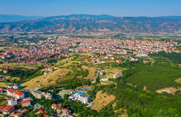 Fototapeta na wymiar Bulgaria, Sandanski, city panorama view from drone. Amazing old Balkan village in Europe famous for hot springs mineral water