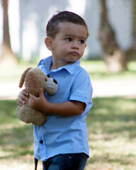 little child playing with a dog