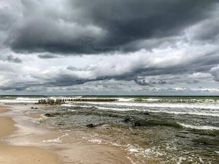 Dark clouds at the sea, stormy weather, dramatic seascape
