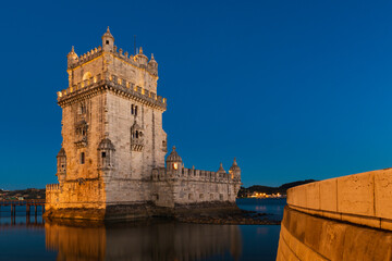 View of the iconic Belem Tower (Torre de Belem) in the bank of the Tagus River, in the city of Lisbon, Portugal.
