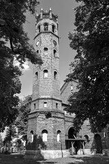 Obraz premium The historic tower of the Gothic red brick church in the city of Skwierzyna