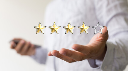 Customer hand touching to yellow illustration 5 stars virtual screening monitor for satisfaction evaluation