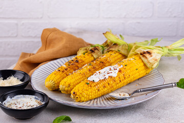 Grilled corn cobs with parmesan cheese