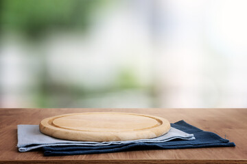 empty table board and defocused indoor background. product display concept