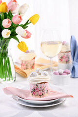  Bird's Nest Easter dessert. The muffin is decorated like a bird's nest of buttercream with quail eggs candy.