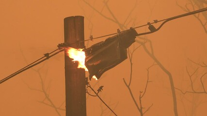 2021 - An electrical transformer is burning and destroyed during the Dixie Fire in Northern California.