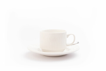 Isolated coffee mug on a white background and a spoon