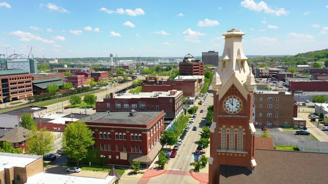 Drone aerial establishing shot of downtown business district Moline Illinois on the Mississippi River.