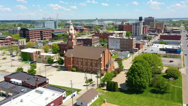 Drone aerial establishing shot of downtown business district Moline Illinois on the Mississippi River.