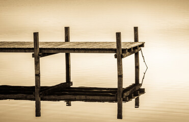 old wooden jetty at a lake in bavaria