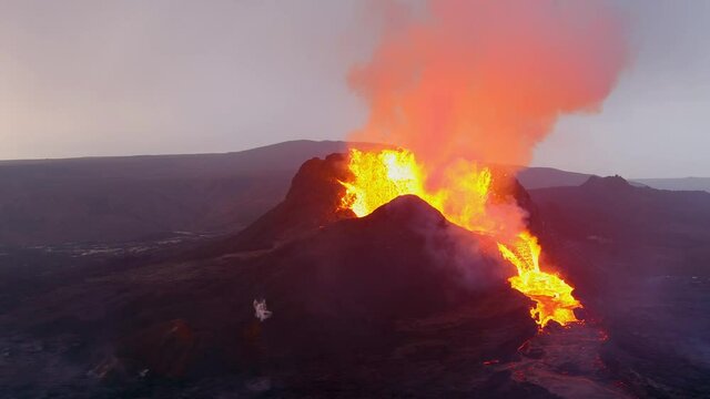 Amazing night drone aerial of the dramatic volcanic eruption of the Fagradalsfjall volcano on the Reykjanes Peninsula in Iceland.