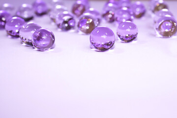 Purple gel on light clean material, macro. Beautiful  holiday classic violet background. Christmas or spring wallpaper. Copy space