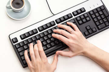 Top view of male hands using black compute keyboard. Working in office