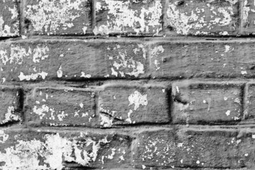 Texture of a brick wall with cracks and scratches which can be used as a background