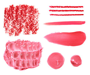 Set of various pink range lipstick smear and crayon stroke samples on white