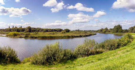 Obraz na płótnie Canvas Panorama view over the Linge river in the Netherlands between Friezenwijk and Gorinchem