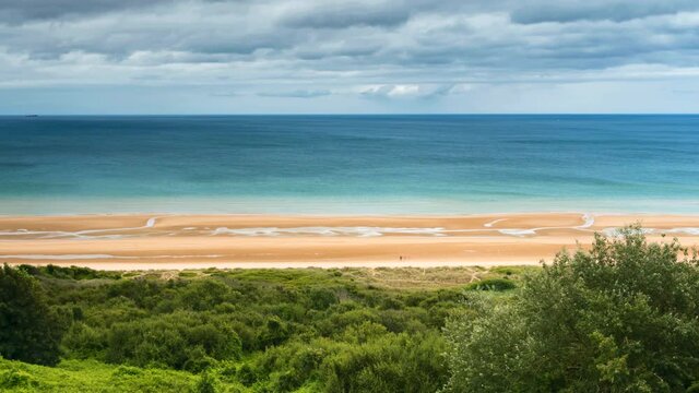 Time lapse of cloudy sky above the Omaha Beach on the Normandy atlantic coast in France