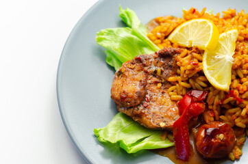 Spicy chicken breast and long grain rice with red peppers, tomatoes and jalapeno chillies