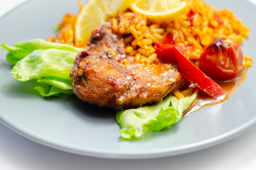 Spicy chicken breast and long grain rice with red peppers, tomatoes and jalapeno chillies