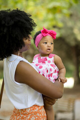 young mother with a child walks in the park. walk