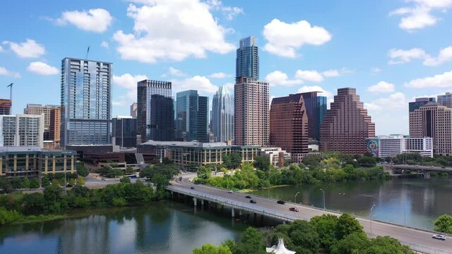 Establishing shot of the Colorado River in downtown Austin, Texas with skyline background.