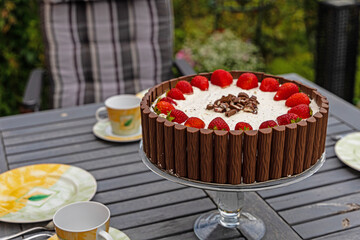 strawberry cake with chocolade palisades around - obrazy, fototapety, plakaty