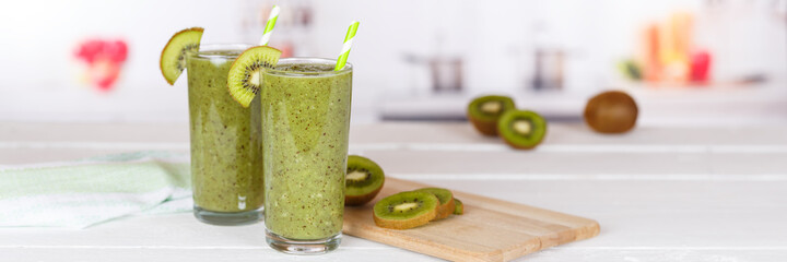 Green smoothie fruit juice kiwi drink in a glass panorama with copyspace copy space