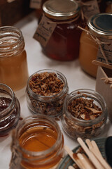 Glass jars with natural flower honey and oatmeal. Organic natural and raw food