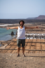 man looking at the salinas of the Janubio in the island of Lanzarote tenerife, canaria islands