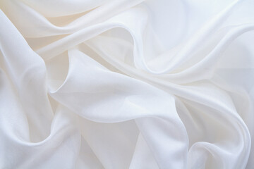 diaphanous white fabric draped with folds, textile wave background
