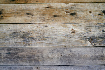 The surface of an old wooden slab house. Old slab texture. Close up brown Wooden planks texture backgrounds