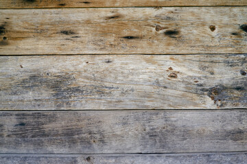 The surface of an old wooden slab house. Old slab texture. Close up brown Wooden planks texture...