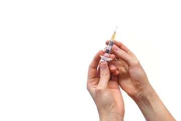 The hands of a woman holding a vaccine injection. Isolated white background.
