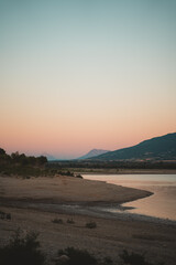 Fototapeta na wymiar Sunset in Yesa swamp shore in northern Spain