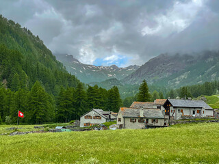 Scenic view of the rocky Swiss mountains surround the quiet village of Simplon.