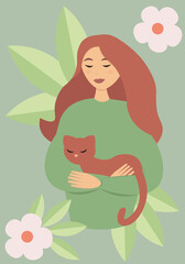 A young red-haired woman holds a ginger cat in her arms. Love for your pet