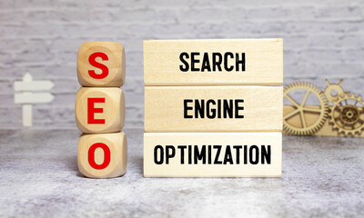 SEO Search Engine Optimization written on dices on blue background