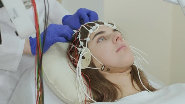 Patient brain testing using encephalography at medical center