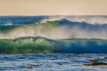 Waves in the early morning light at the seaside