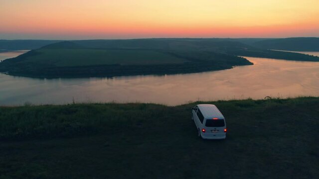 The car stop on the mountain top on beautiful river background