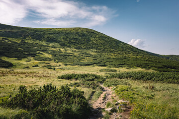 beautiful landscape of mountains. walks in the mountains. meeting of mountains with the sky