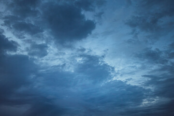 Naklejka na ściany i meble blue evening sky with dark clouds.