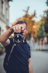 photography concept. photographer holding a camera in his hand.