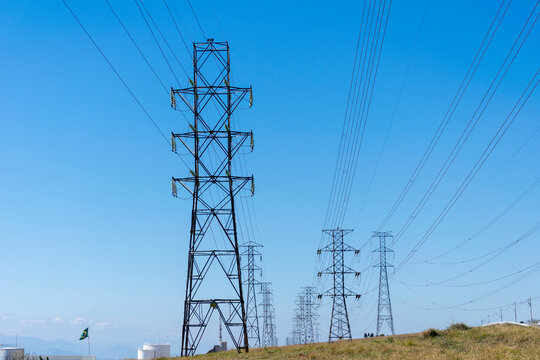 network of power towers with blue sky background